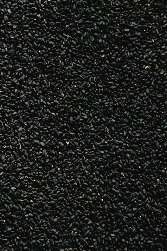 Detailed shot of black nigella seeds, perfect for culinary and texture presentations.