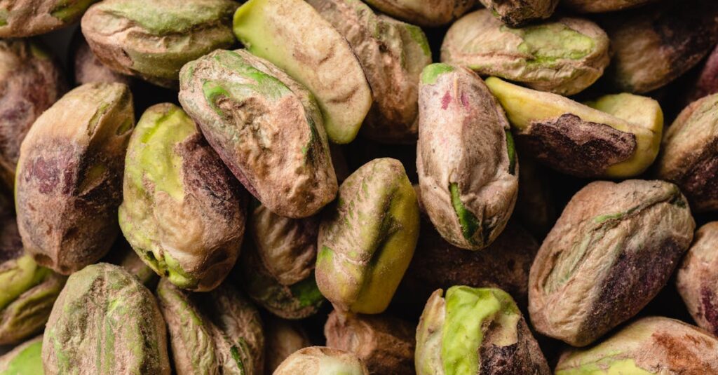 Macro shot of unshelled pistachios showcasing natural texture and colors.